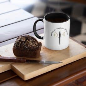 mockup featuring an oz colored rim mug placed next to a muffin